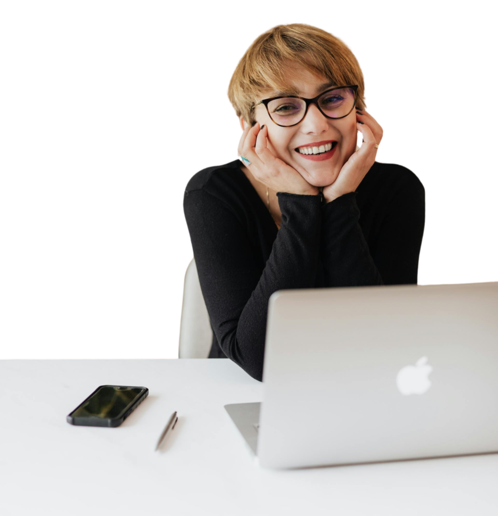 Girl Smiling and sitting on a Chair with a Laptop