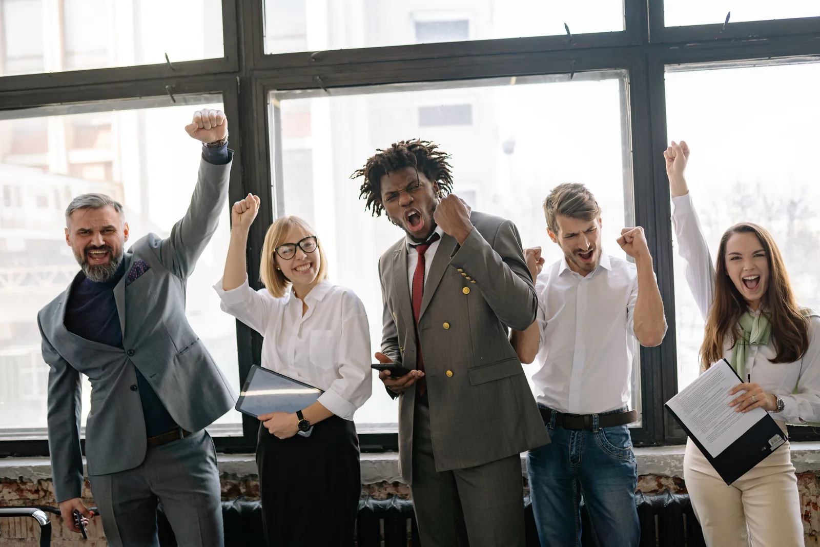 Team celebrating a good month